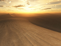 sunset over desert sand dunes 