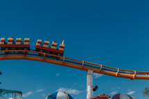 roller coaster against a blue sky 