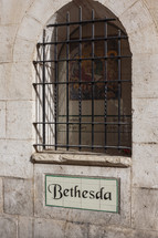 Bethesda sign under a window 