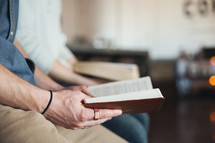 men reading Bibles together at a Bible study 