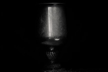 reflection of light on a metal chalice 