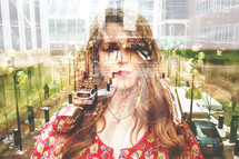 double exposure of a woman and cityscape 