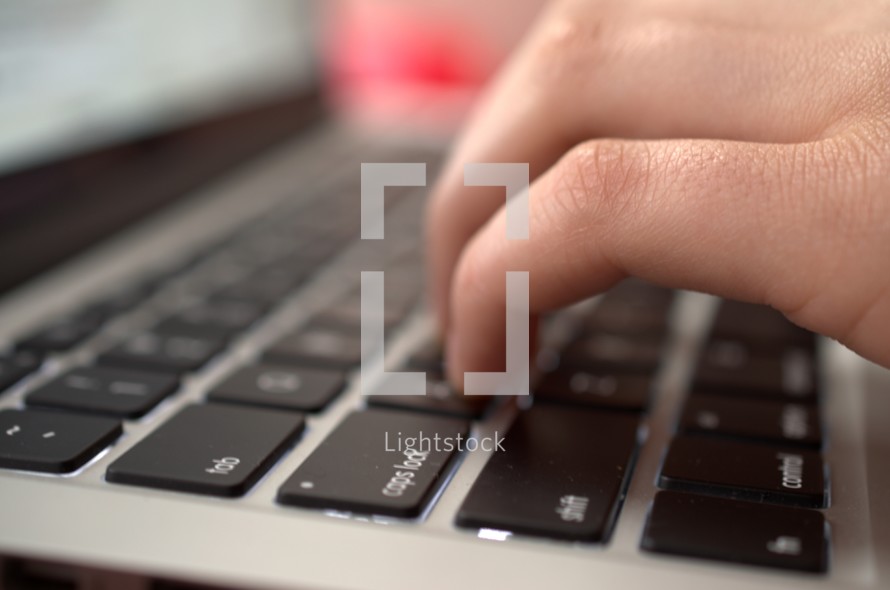 hands on a laptop keyboard 