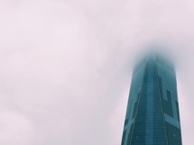 skyscraper in fog 