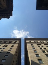 blue sky between buildings 