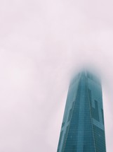 skyscraper in fog 