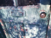 peeling paint on a wood door 