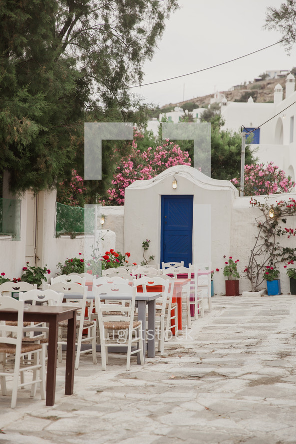 outdoor table and chairs in a courtyard in Greece 