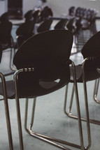 A classroom full of empty chairs.