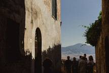 people gathered in front of a chapel in Italy 