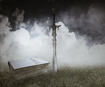 sword and Bible on grass