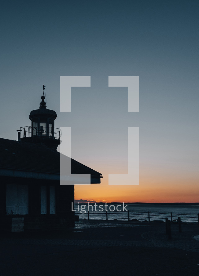 unlit lighthouse at night 