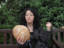 Woman with large loaf of bread