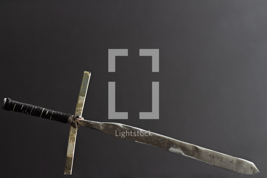 sword cross on gray background 