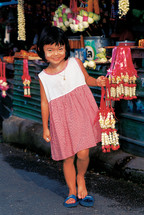Girl child in a market in Thailand