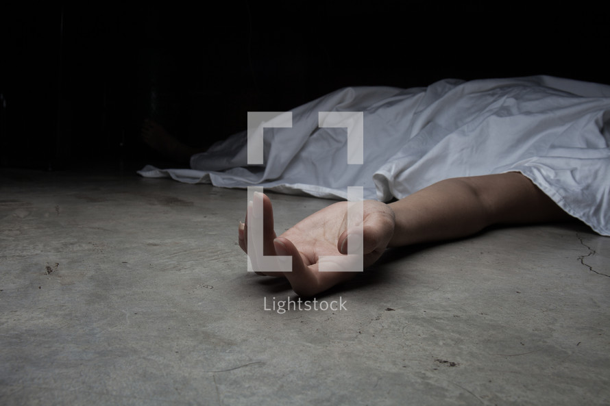 a dead body under a sheet 