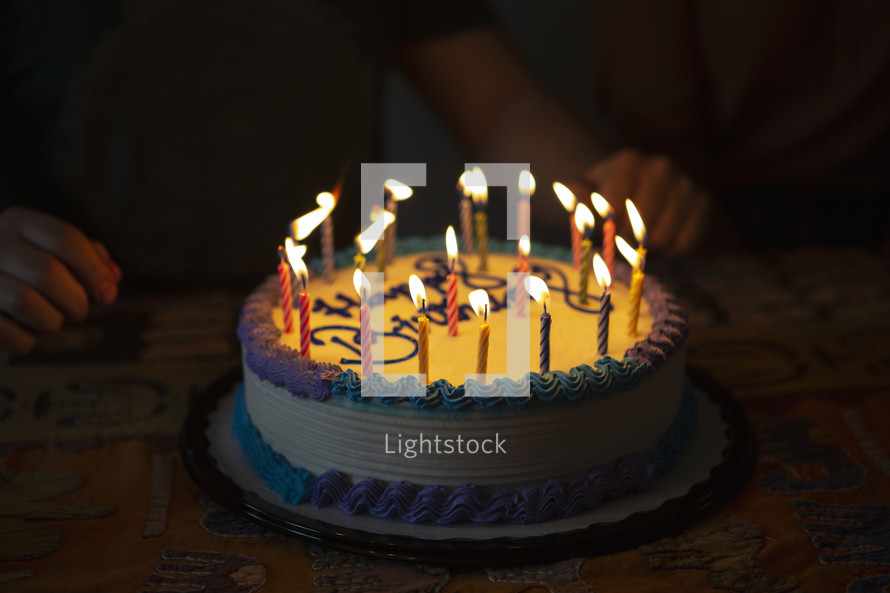 lit candles on cake