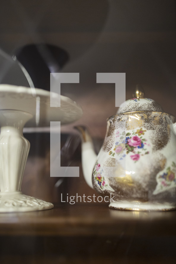 old teapot in cupboard
