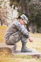 female soldier praying 