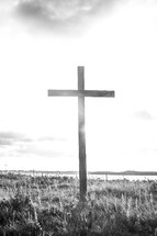 a wood cross on a hilltop 