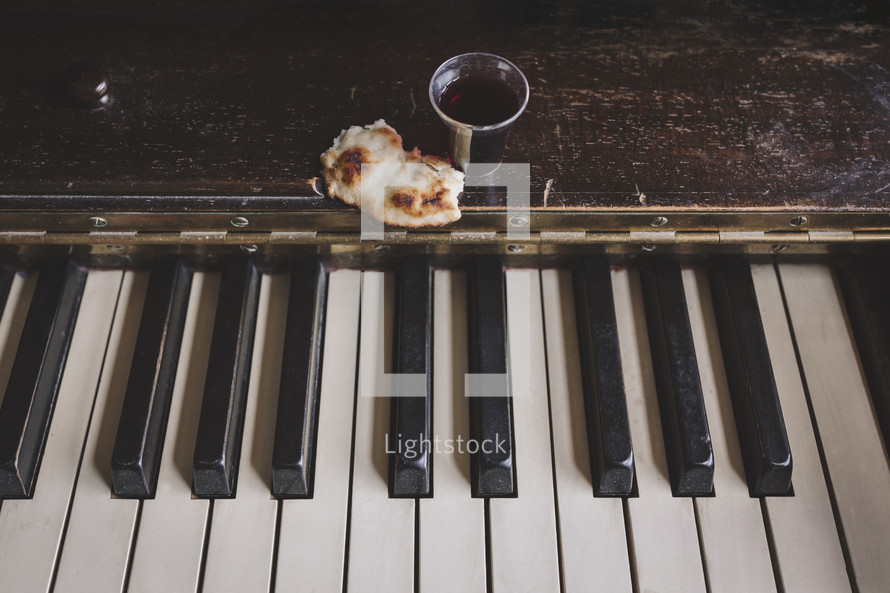 wine and bread on piano for communion service