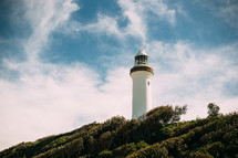 lighthouse against a blue sky 