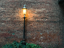 lamppost and brick wall 