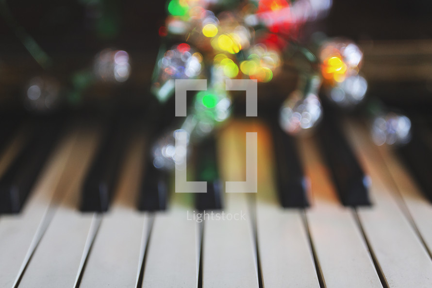 Christmas lights on piano keys 