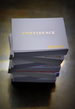 stack of business cards with the word confidence 