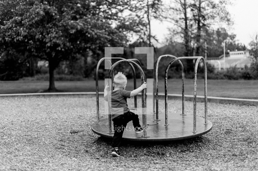 toddler boy on a playground 