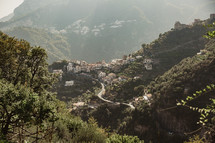 houses and a road on a mountaintop in Italy