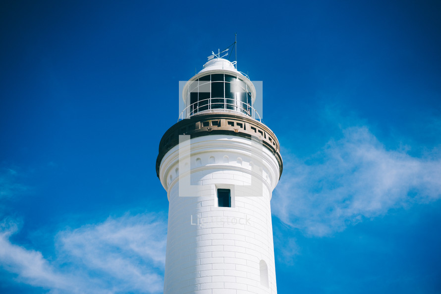 lighthouse against a blue sky 