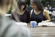 girls in prayer at a Bible study 