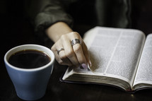 a girl reading a Bible at a Bible study 
