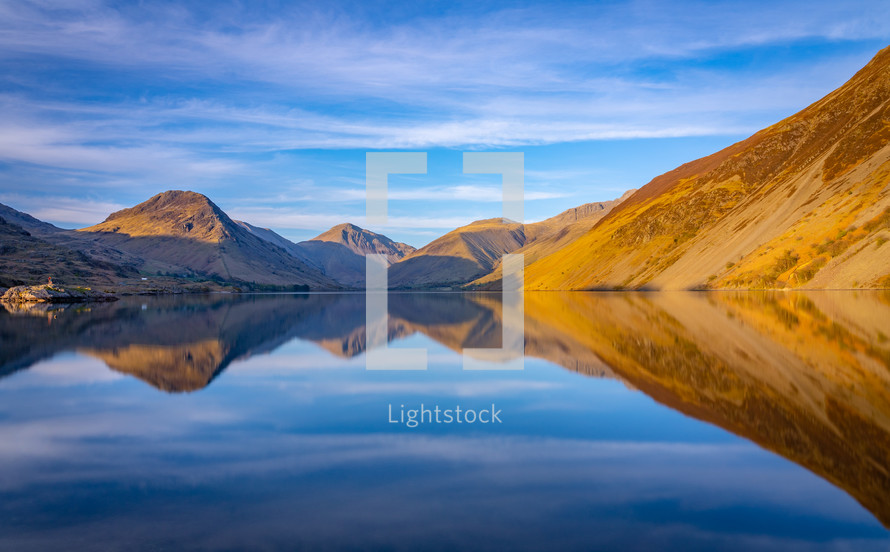 reflection of mountains in lake water 