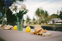centerpiece, bread, and duck on a table 