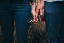 man and woman touching hands 