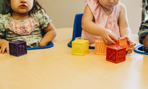 toddler playing with blocks 