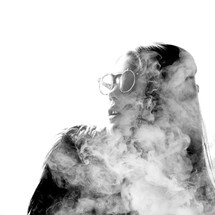 A woman engulfed in smoke 