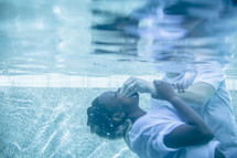 a woman being baptized in water 