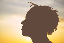 silhouette of the side profile of a man's head 