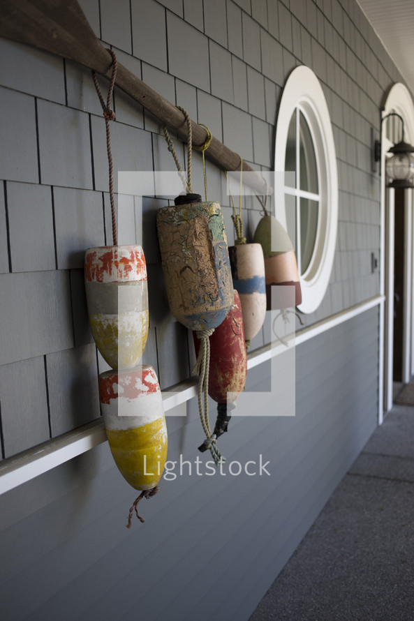 nautical decorations hanging on the front of a house 
