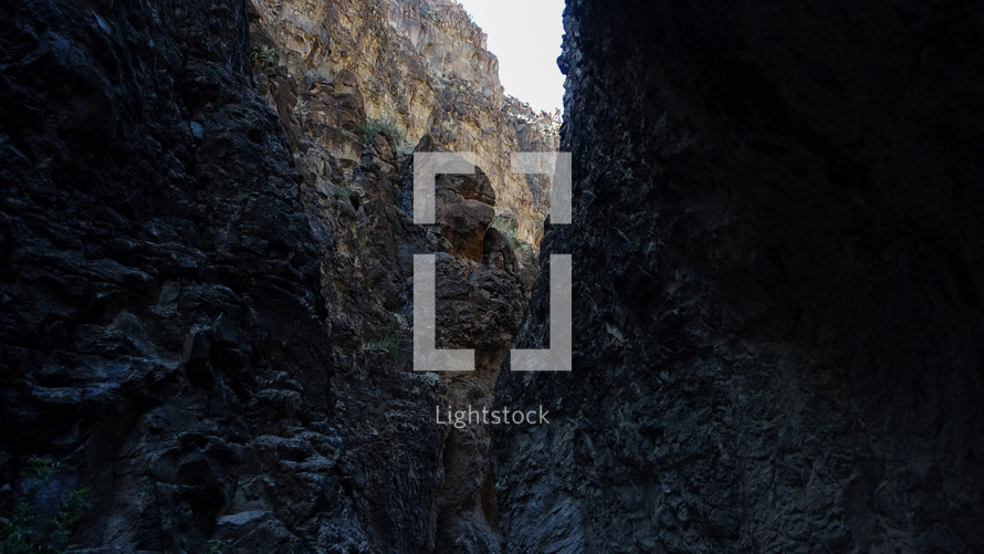 light shining between a rock crevice 