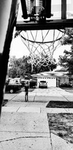 boy playing basketball in his driveway 