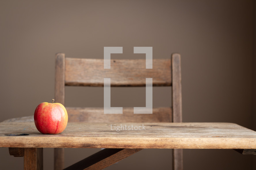 apple on a student desk 