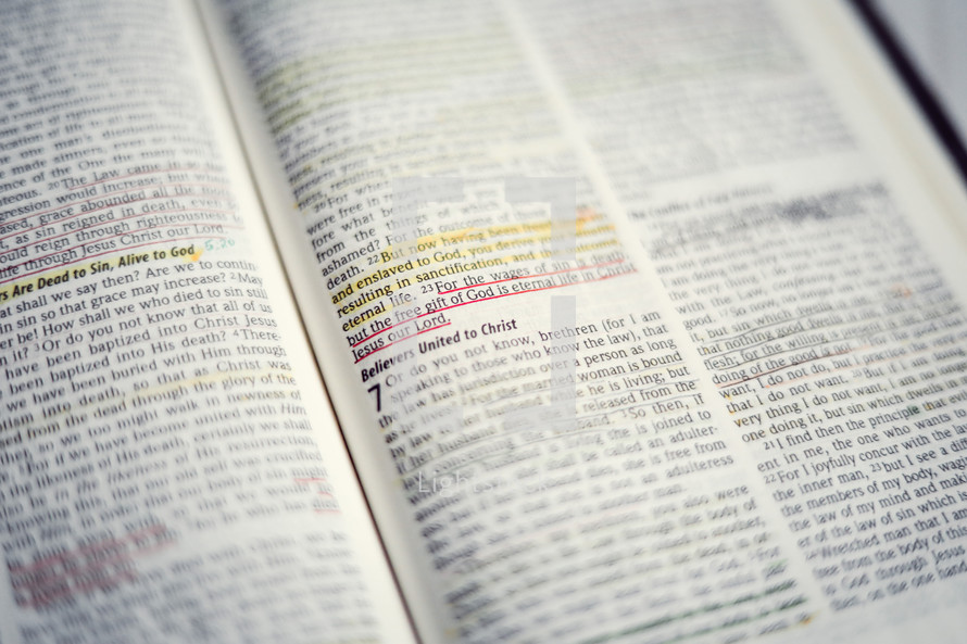 highlighted scripture on the pages of a Bible 