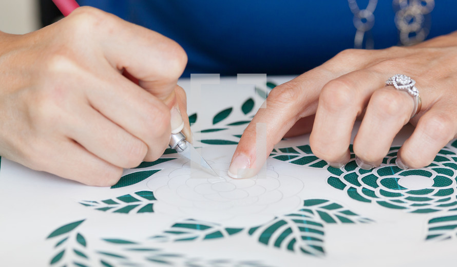 woman crafting, cutting paper 