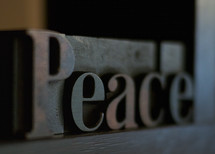 Peace spelled out in letter press type set letters
