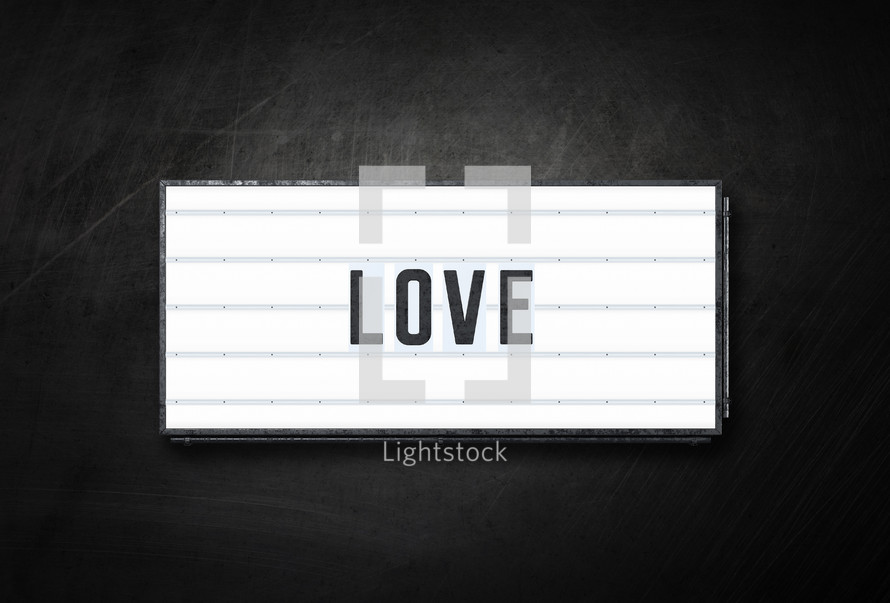The word love on a backlit sign.