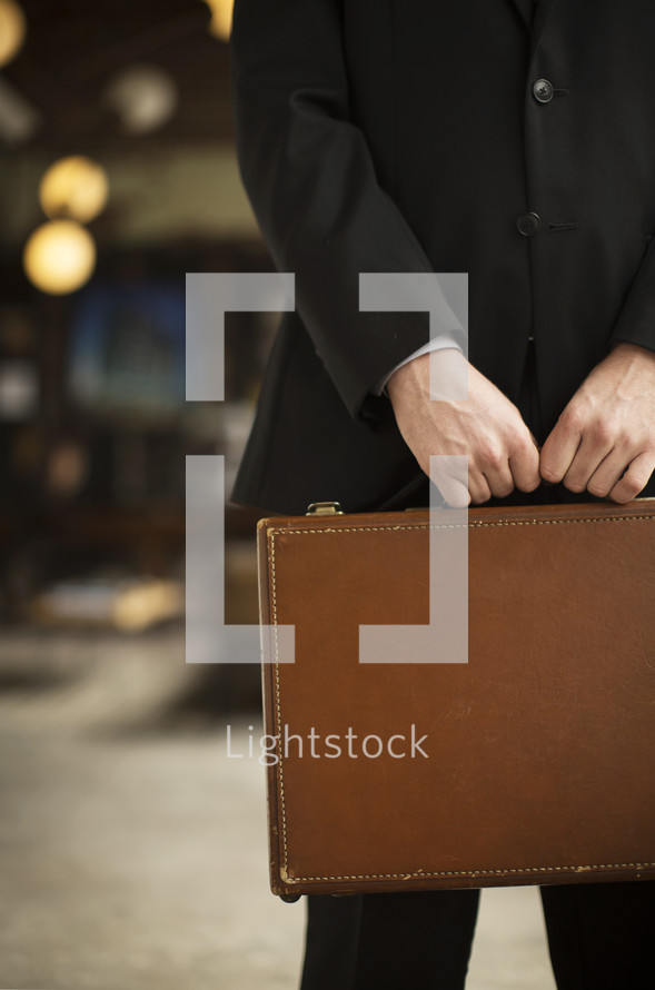 businessman carrying a briefcase 